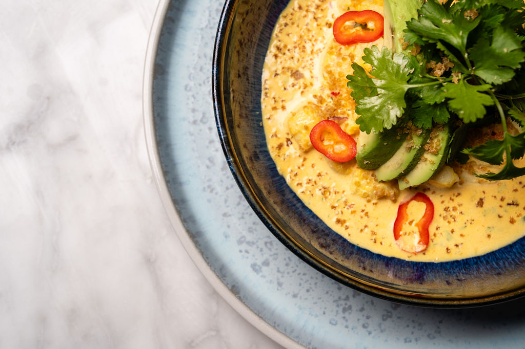Yellow curry with cilantro and red chili