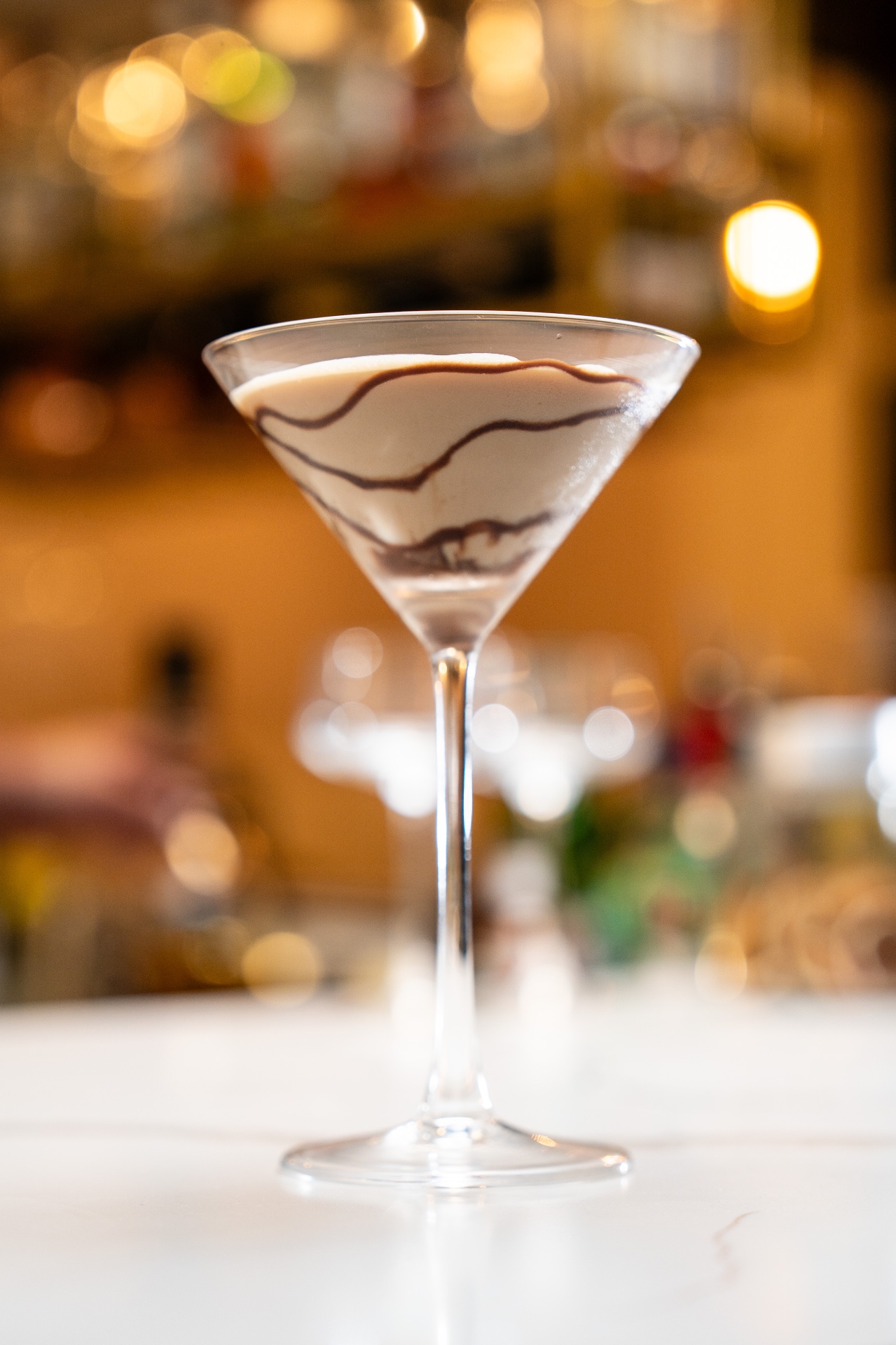 Chocolate martini with cocoa swirl at the bar