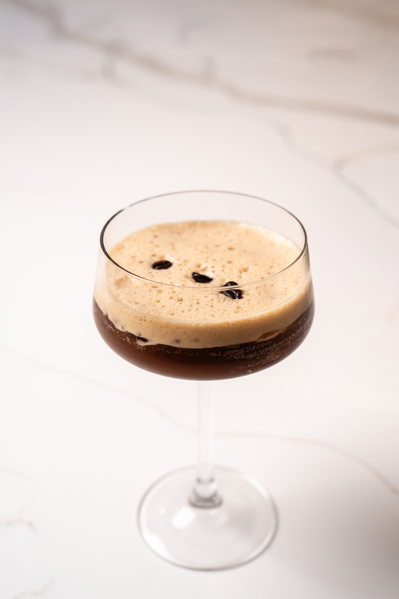 Espresso martini topped with coffee beans