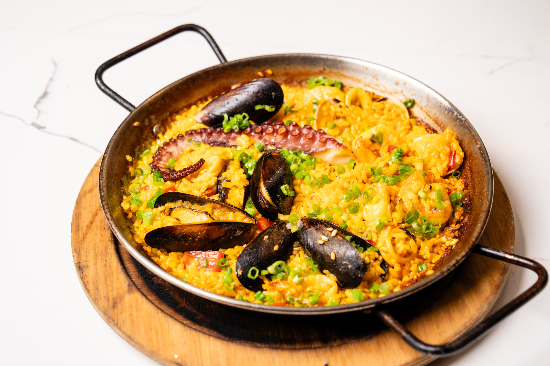 Seafood paella with mussels and octopus